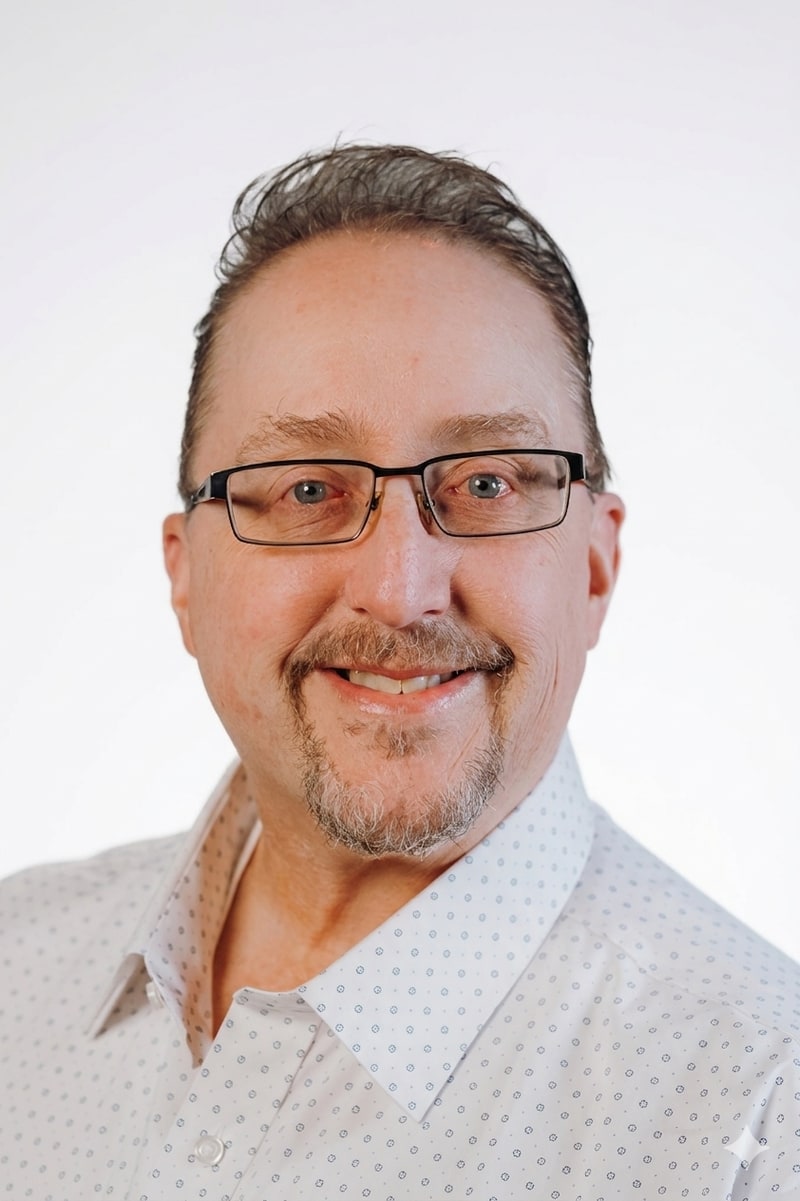 Don Tiegs, founder of Northland Financial Solutions, in a professional headshot wearing glasses and a white button-down shirt.